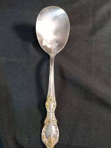 lot 60210 image: Decorative Serving Spoon with Ornate Handle