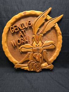 lot 3787 image: Genius at Work Carved Wood Wall Plaque with Bug Character