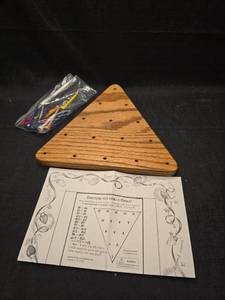 lot 2128 image: Qualls & Son Novelties Directions for Being a Genius Triangle Peg Game