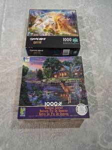 lot 11 image: Lot of 2 Jigsaw Puzzles 1000 Pieces - Buffalo Games Unicorn Sunset Glitter Edition & Ceaco Weekend Retreat