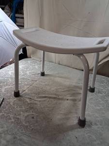 lot 37 image: White Plastic Shower Bench with Curved Seat and Metal Frame