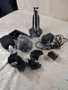 lot 66 image: Hair Clipper Trimmer with Multiple Guard Attachments and Charging Dock