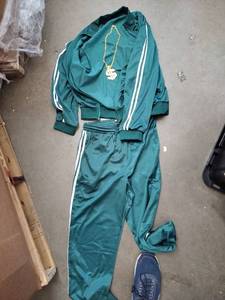 lot 2495 image: Blade is two-piece tracksuit costume size L green with bling necklace glasses and ring