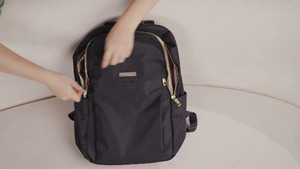 lot 20269 image: Golf Quality Black Mini Backpack with Tan Interior and Gold Hardware