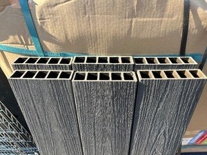 lot 121 image: Bundle of 6 Pieces Trex Wood Styled Boards 44.5 x 5 x 1.5 - Grey see images