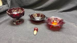 lot 40 image: Ruby Red Glass Collection - Compote, handled Bowl, Candle Holder and Bottle Stopper