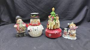 lot 112 image: Holiday Ceramic Figurine Set 4 Pieces Snowman Caroler Christmas Decorations