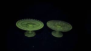 lot 150 image: Clear Glass Pedestal Pie Plates,Manganese Glow (Lot of 2).