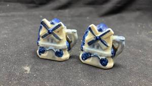 lot 155 image: Pair of Blue and White Ceramic Salt and Pepper Shakers, Windmill Design
