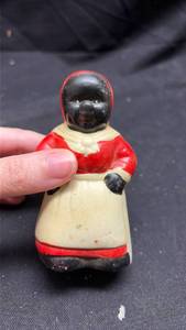 lot 157 image: Black Figure Salt & Pepper Shaker in a Red and White Outfit