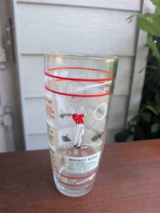 lot 3004 image: Cocktail Recipe Drinking Glass with Red Bands and Golf Motif