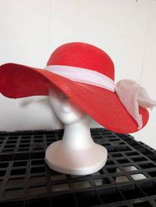 lot 4504 image: Artino Red Straw Wide Brim Hat with Pink Ribbon Band  Foam Head Display