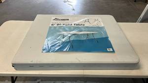 lot 8019 image: Peakform 6 ft Bi-Fold Table with Folding Legs, Carrying Handle and Locking Tab for Tabletop