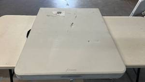 lot 8025 image: Peakform 6 ft Portable Folding Table with Locking Legs, Carrying Handle and Locking Tab for Tabletop.