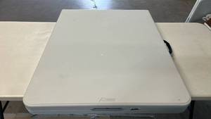 lot 8026 image: Peakform 6 ft Portable Folding Table with Locking Legs, Carrying Handle and Locking Tab for Tabletop.
