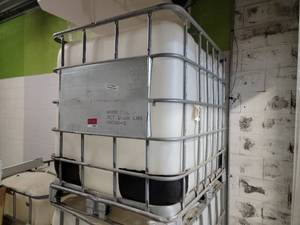 lot 16162 image: 275 Gallon IBC Tank With Metal Cage