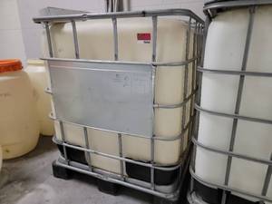 lot 16164 image: 275 Gallon IBC Tank With Metal Cage