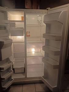 lot 1010 image: Kenmore Side by Side Refrigerator.   69.5 x 36 x 37