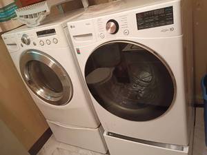 lot 1012 image: LG  Thin Q Washer and LG True Steam Dryer.     Both have pedestals.   Both 52.5 x 27 x 30