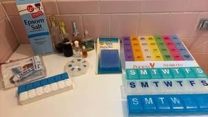 lot 1402 image: Pill Organizers Epsom Salt Biotene Trial Pack Fragrance Bottles