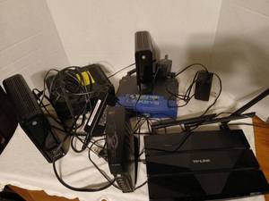 lot 1443 image: Networking Equipment Lot with Linksys Router TP-Link Switch and Motorola Modems