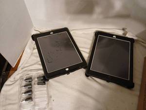 lot 1447 image: Apple Tablets in otterCases with Charging Adapters Lot of 2 unknown on working  conditions