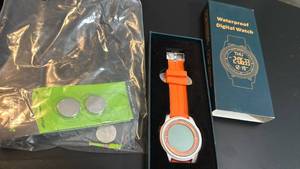 lot 1617 image: Waterproof Digital Watch with Orange Band and Replacement Batteries