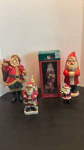 lot 1727 image: Kurt S. Adler Santa Tabletop Figurine with other Santa Clauses