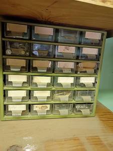 lot 2035 image: Storage Compartments with Content.   24 drawers