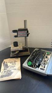 lot 2219 image: Dremel Moto-Tool Drill Press Model 210 with Router and Accessories
