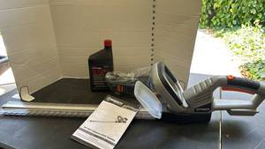 lot 2242 image: Worksite 20V Max Cordless Hedge Trimmer CHT224 with Accessories and Manual