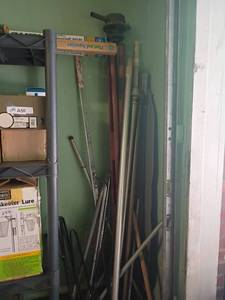lot 2315 image: Corner of Miscellaneous.     Poles, Table Legs and More