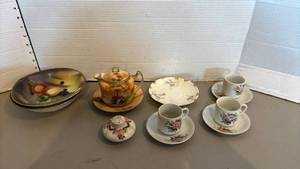 lot 1423 image: Porcelain Tea Service Lot Teapot Cups Saucers Plates Painted Floral Fruit