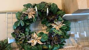 lot 1503 image: Artificial Floral Wreath with Dark Flowers and Green Foliage