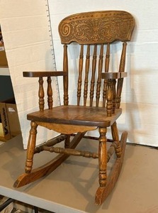 lot 1657 image: Childs Wooden Rocking Chair with Carved Back and Spindle Design