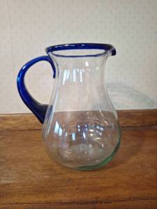lot 29 image: Glass Pitcher with Blue Rim and Handle