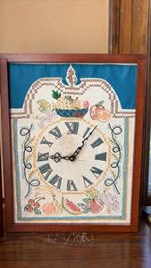 lot 111 image: Shadowbox Embroidery Sampler Fruit Basket with Roman Numerals Wall Clock Approximately 18 by 13 inches