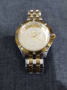 lot 2451 image: Two-Tone Stainless Steel Watch with Crown and Laurel Dial