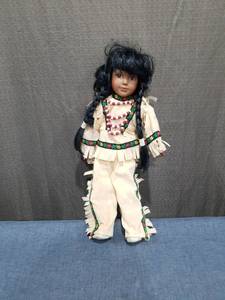 lot 2470 image: Doll with Black Hair and Native American-Style Costume
