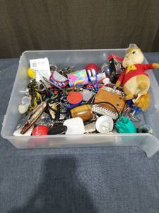 lot 2480 image: Mixed Lot Assorted Small Items Keychains Trinkets Plush Figurines in Plastic Bin
