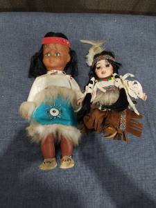 lot 2546 image: 2 Native American Theme Dolls with Fur Trim and Beaded Details