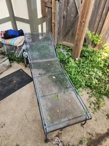 lot 145 image: Vintage Mid-Century Style Wrought Iron & Mesh Rolling Patio Chaise Lounge