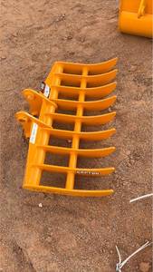 lot 585 image: Cat 305 dense teeth rake 44