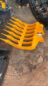 lot 587 image: Cat 305 dense teeth rake 32