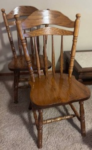 lot 911 image: Pair of oak spindle back dining chairs (located in basement)