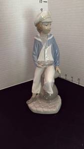 lot 1004 image: Lladr� Boy with Yacht porcelain figurine