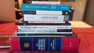 lot 2062 image: Books Including The Websters Dictionary and Thesaurus