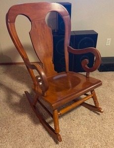 lot 910 image: Wooden rocking chair 37 x 21 x 29 in seat width 18 in (located in basement)