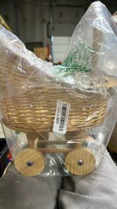 lot 23193 image: Wicker Baby Pram Basket with Wooden Wheels - Retail $20