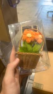 lot 22193 image: Wicker Basket with Knitted Orange Flowers Decoration